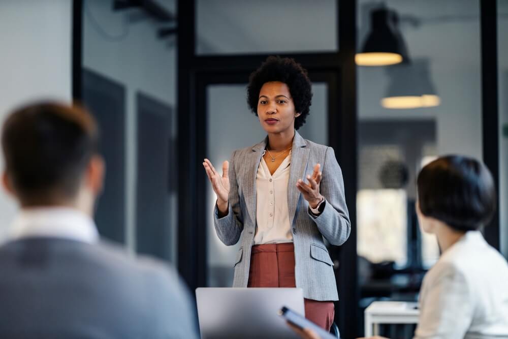 A business advisor discusses fair value accounting in a team meeting.