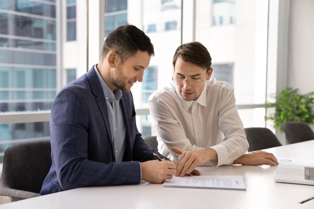 A team discusses buy side due diligence services contract